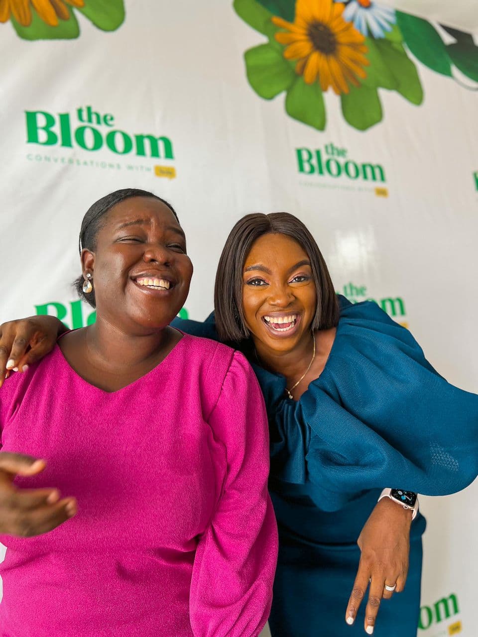 Two women laughing at a Bloom event
